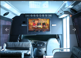 Party bus interior with TV and lounge seating