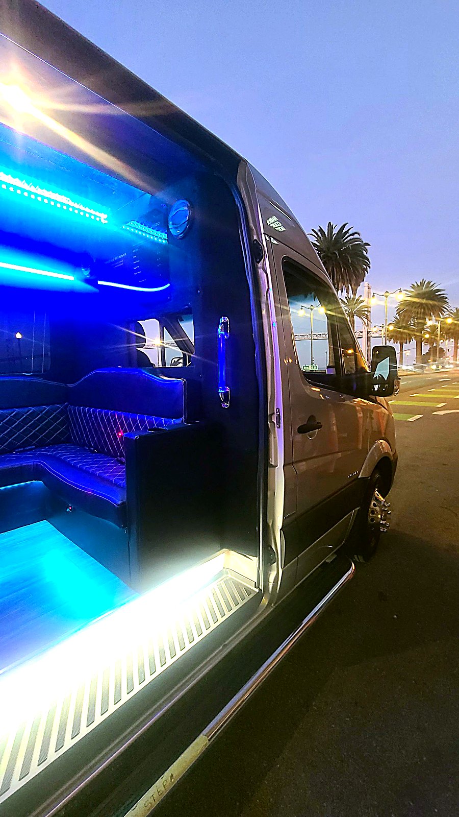 Party bus interior with blue LED lighting — Your Limo Bus