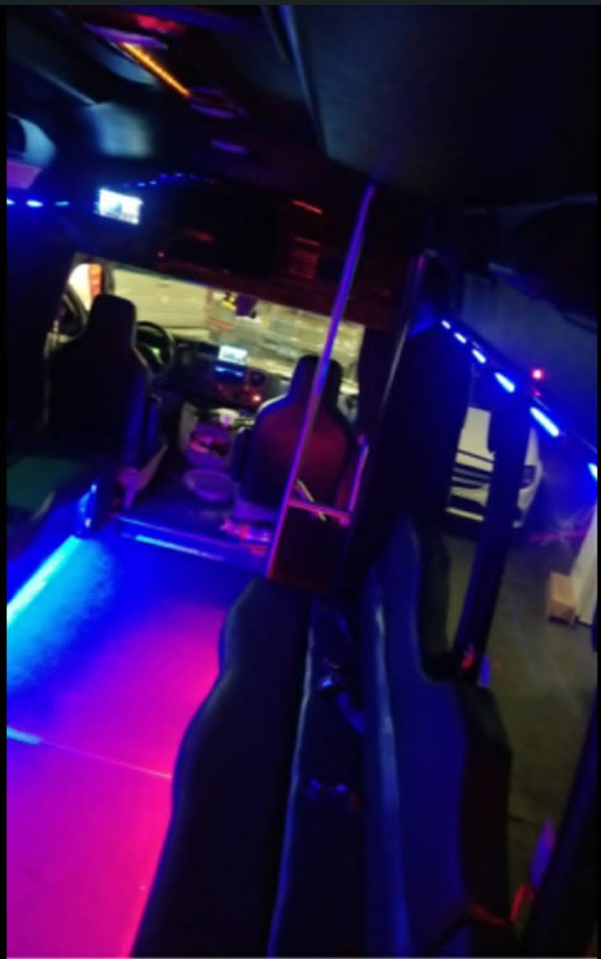 Party bus interior with blue and purple LED lighting