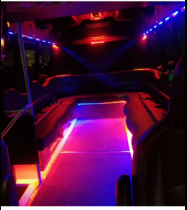 Party bus interior with colorful LED lounge lighting