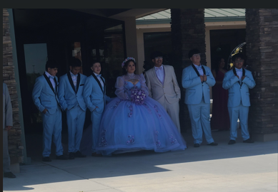 A quinceañera and her court, dressed and ready — a real Your Limo Bus celebration